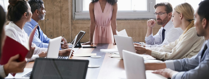 Black businesswoman addressing colleagues at a board meeting